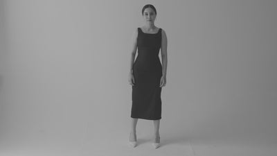 Classic black and white video of Carol in black 90's Midi dress in front of white cyc wall